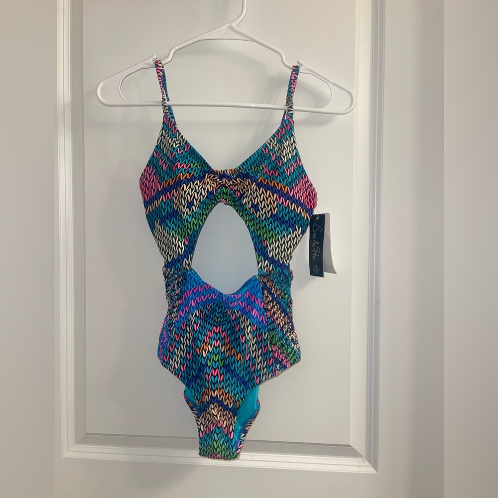 Sea & Her colorful one piece bathing suit with cut outs
